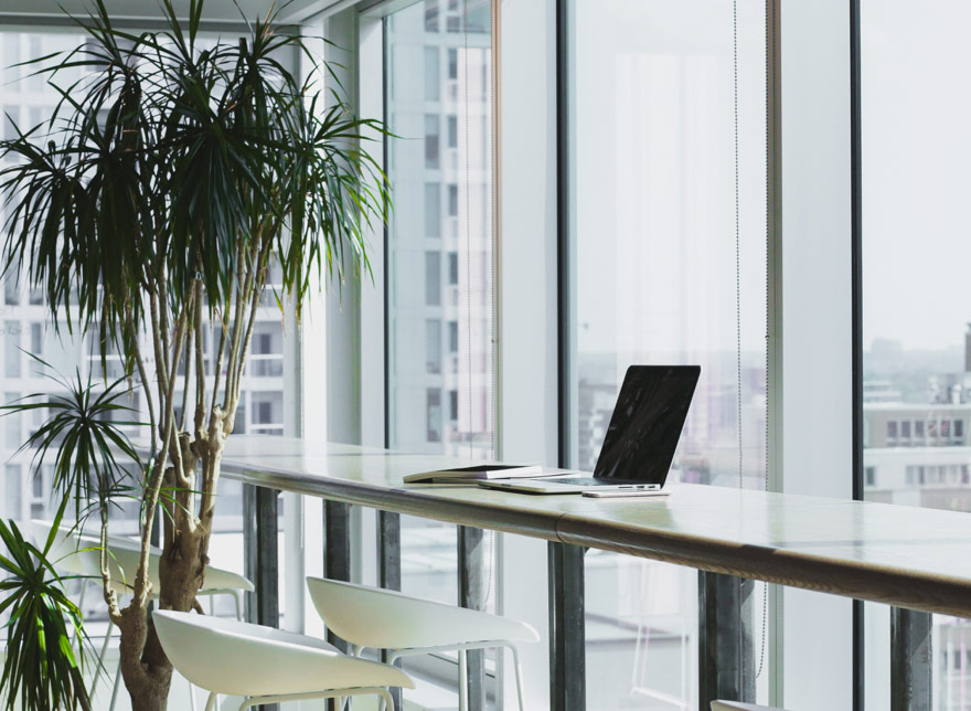 Laptop in office by window